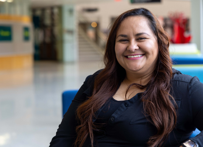 An Oakton College student smiles.