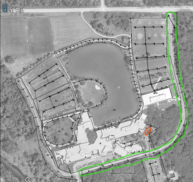 A satellite view of Oakton College's C parking lot with an orange highlight around it to denote construction.