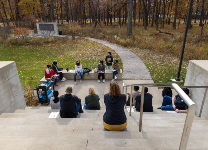 Students sitting on Des Plaines steps.