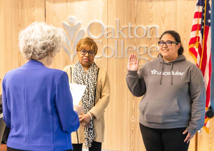 Oakton College Trustee Theresa Bashiri-Remetio (right, facing) was sworn in on April 25 during the Board of Trustees reorganization meeting. Trustee Martha Burns (left, facing) was reelected to serve a second term earlier this month. 
