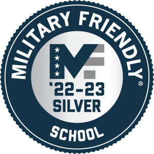 A navy blue circle with the words Military Friendly School around the outer ring. The inner ring features a MF logo and '22-23 Silver in text. 